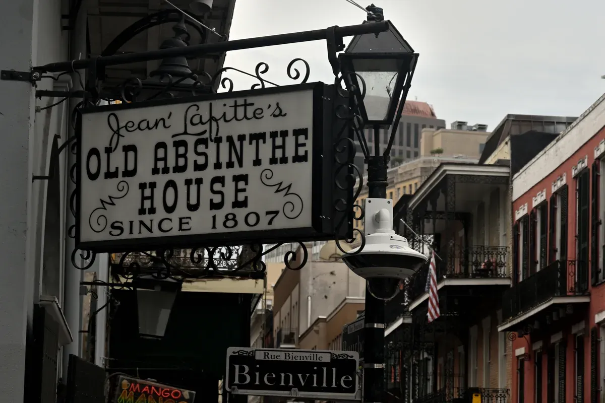 The Old Absinthe House sign on Bourbon Street, in the French Quarter of the Lucky Bean New Orleans ghost tour